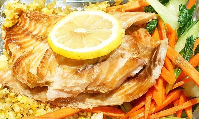 A Premium paleo spin on Chinese takeout -  tamari glazed wild Snapper atop organic cauliflower "fried rice", fresh organic bok choy and shredded carrots