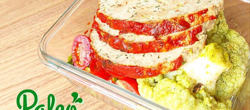 Homestyle mixed grassfed beef and free range chicken meatloaf served atop paleo chimichurri tossed organic Roasted cauliflower and grape tomato cilantro salad