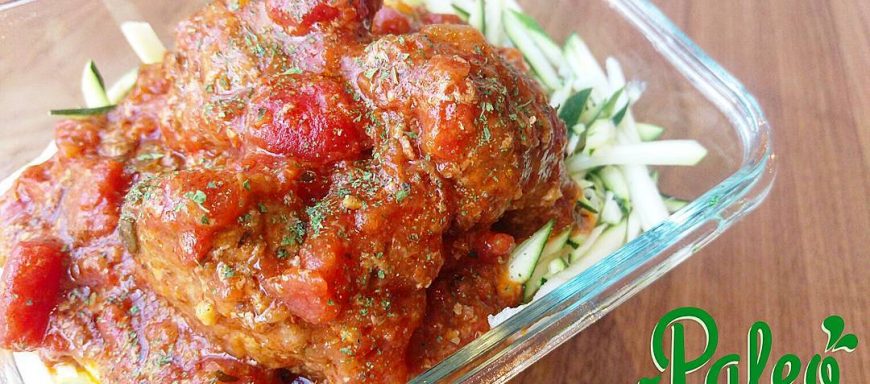 Nonnas handmade grassfed meatballs in overnight Sunday gravy atop organic julienned zuchinni "noodles