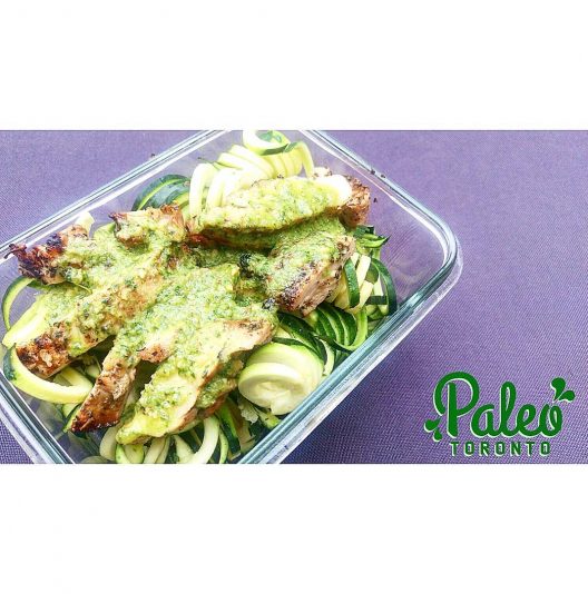 Grilled free range  Ontario chicken in organic almond/cashew basil pesto sauce atop spiralized organic zuchinni noodles